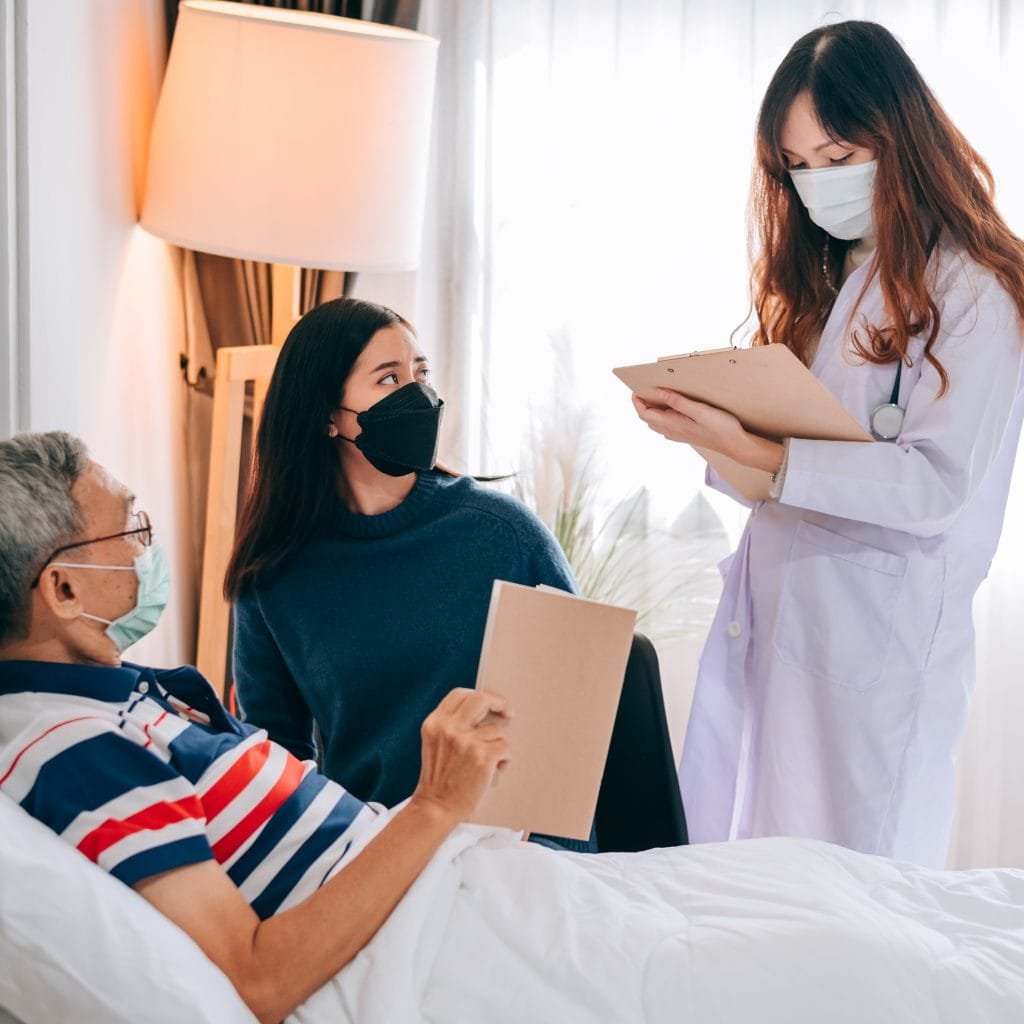 asian-doctor-visit-examines-senior-man-home-doctor-checking-up-consulting-retirement-health-partienthospital-services-wearing-mask-protect-covid19